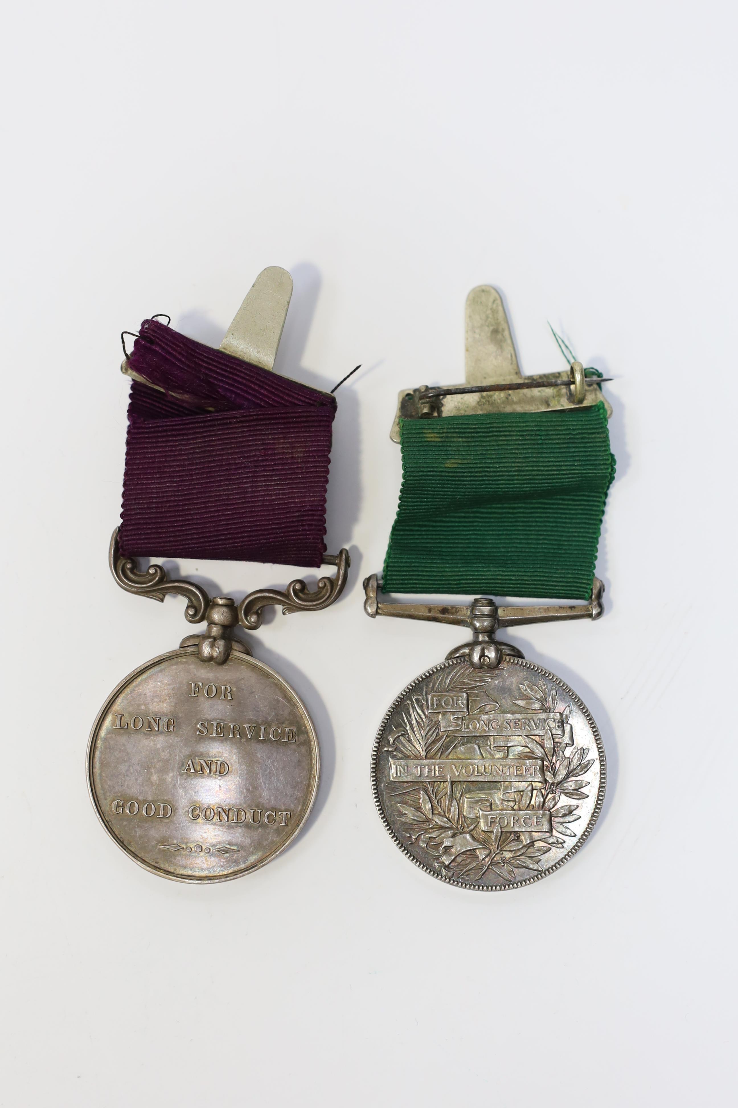 A Victorian LSGC medal to 1843 C:Sgt J.Cook. Gord. High'rs. and an unnamed Victorian Volunteer Long Service medal. Condition - fair